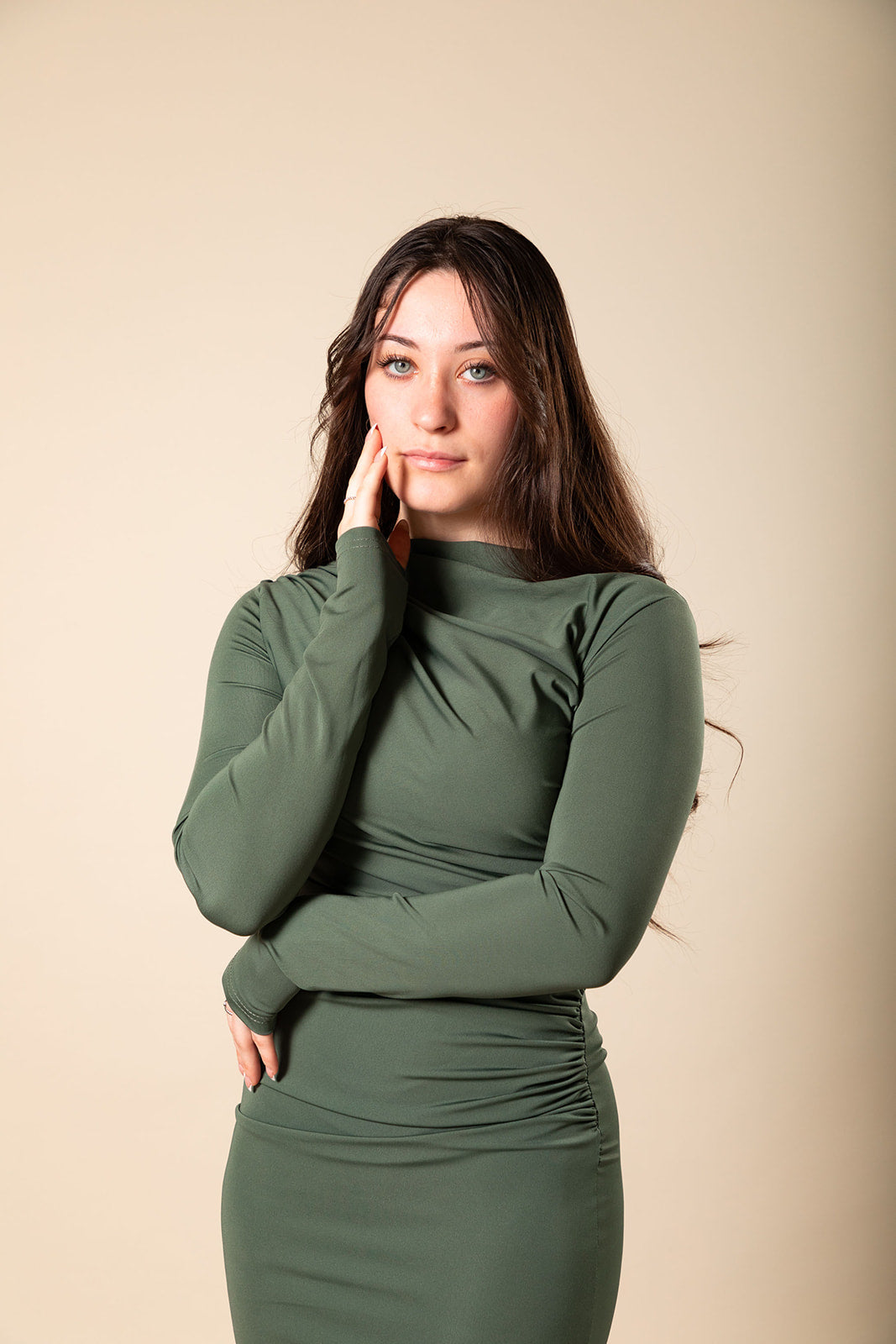 A stylish Olive Green Ruched Midi Dress, featuring a flattering gathered design, flowing silhouette, and elegant midi length. Perfect for any occasion, this dress combines comfort and fashion in a chic olive green hue