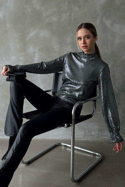 Zümrüt Gold Glitter Blouse - A stunning metallic shimmer adorns this chic blouse, showcasing a loose-fitted mock neck and elegant bishop sleeves. Versatile and modest, perfect for year-round wear.